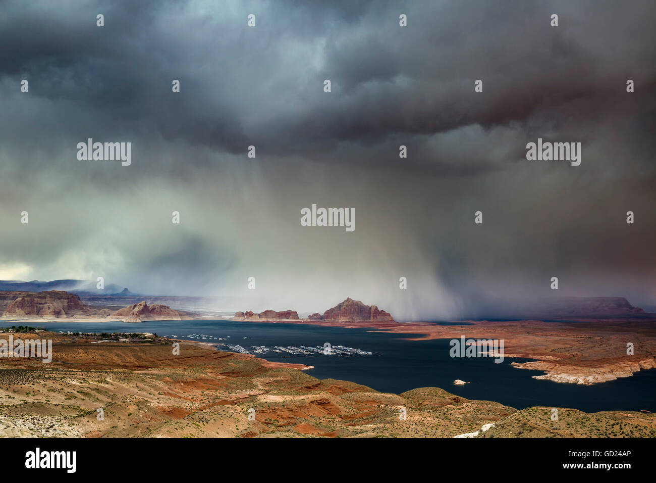 A storm obscures Grand Staircase-Escalante National Monument as it sweeps across Lake Powell and Wahweap Bay, Page, Arizona, USA Stock Photo