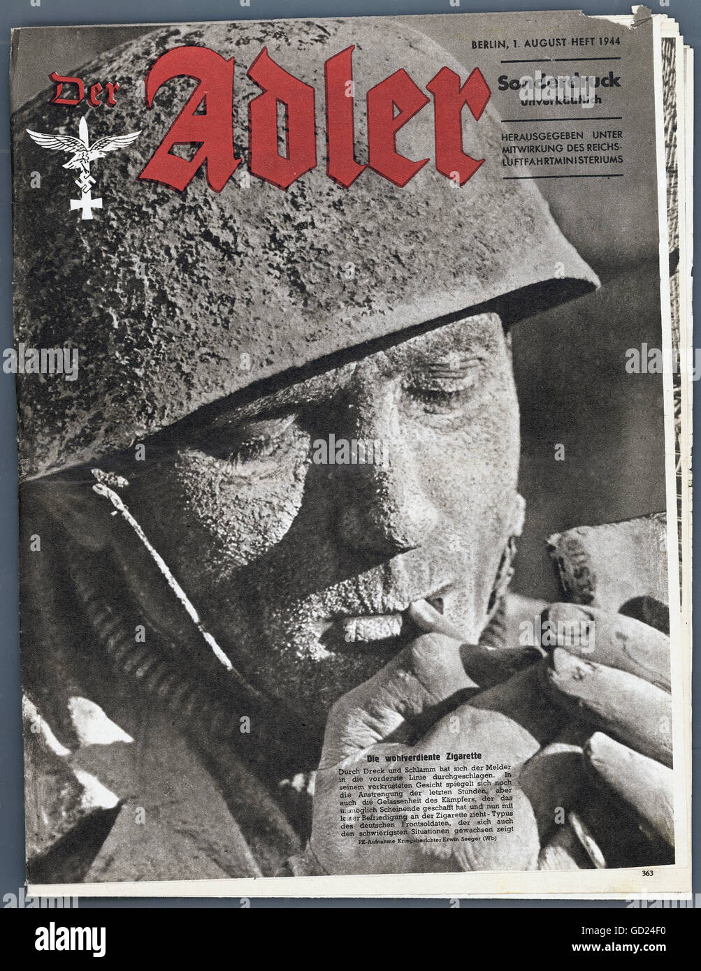 events, Second World War / WWII, propaganda, title page of the magazine 'Der Adler', special issue, 1.8.1944, muddy German paratrooper lighting a cigarette, Additional-Rights-Clearences-Not Available Stock Photo