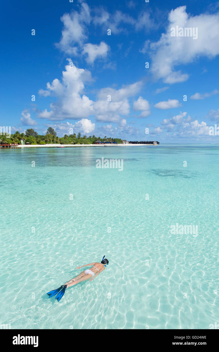 Woman snorkelling at Olhuveli Beach and Spa Resort, South Male Atoll, Kaafu Atoll, Maldives, Indian Ocean, Asia Stock Photo