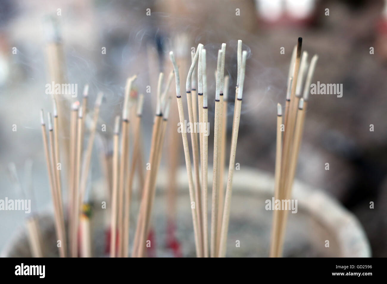 Close-up of incense sticks burning, Wat Si Muang (Simuong) Buddhist temple, Vientiane, Laos, Indochina, Southeast Asia, Asia Stock Photo