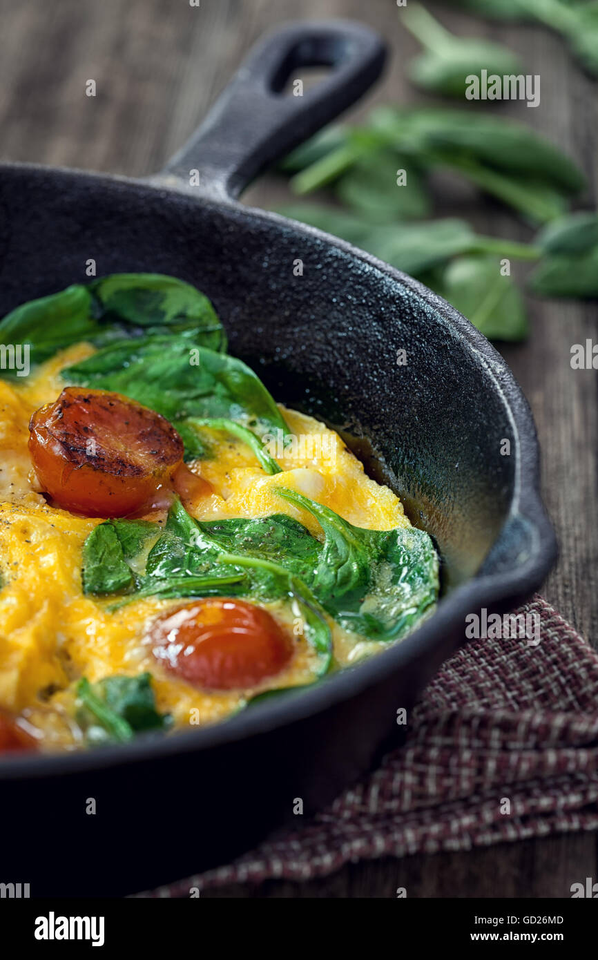 Spinach frittata in iron skillet Stock Photo Alamy