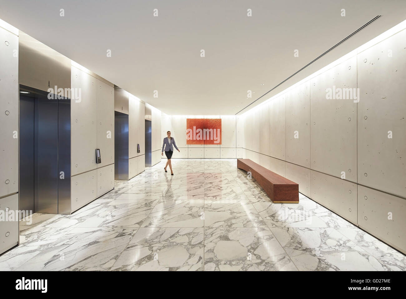 Elevator lobby with white marble flooring. Fitzroy Place, London, United Kingdom. Architect: Sheppard Robson, 2015. Stock Photo