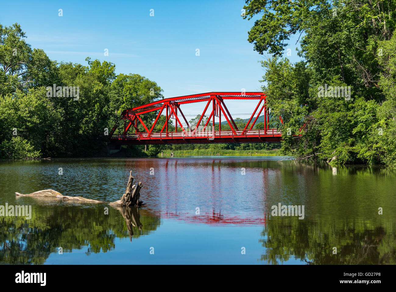 Red Bridge in bright daylight on Route 32 over the Wallkill River near Rifton in the Catskills of Upstate New York. Stock Photo