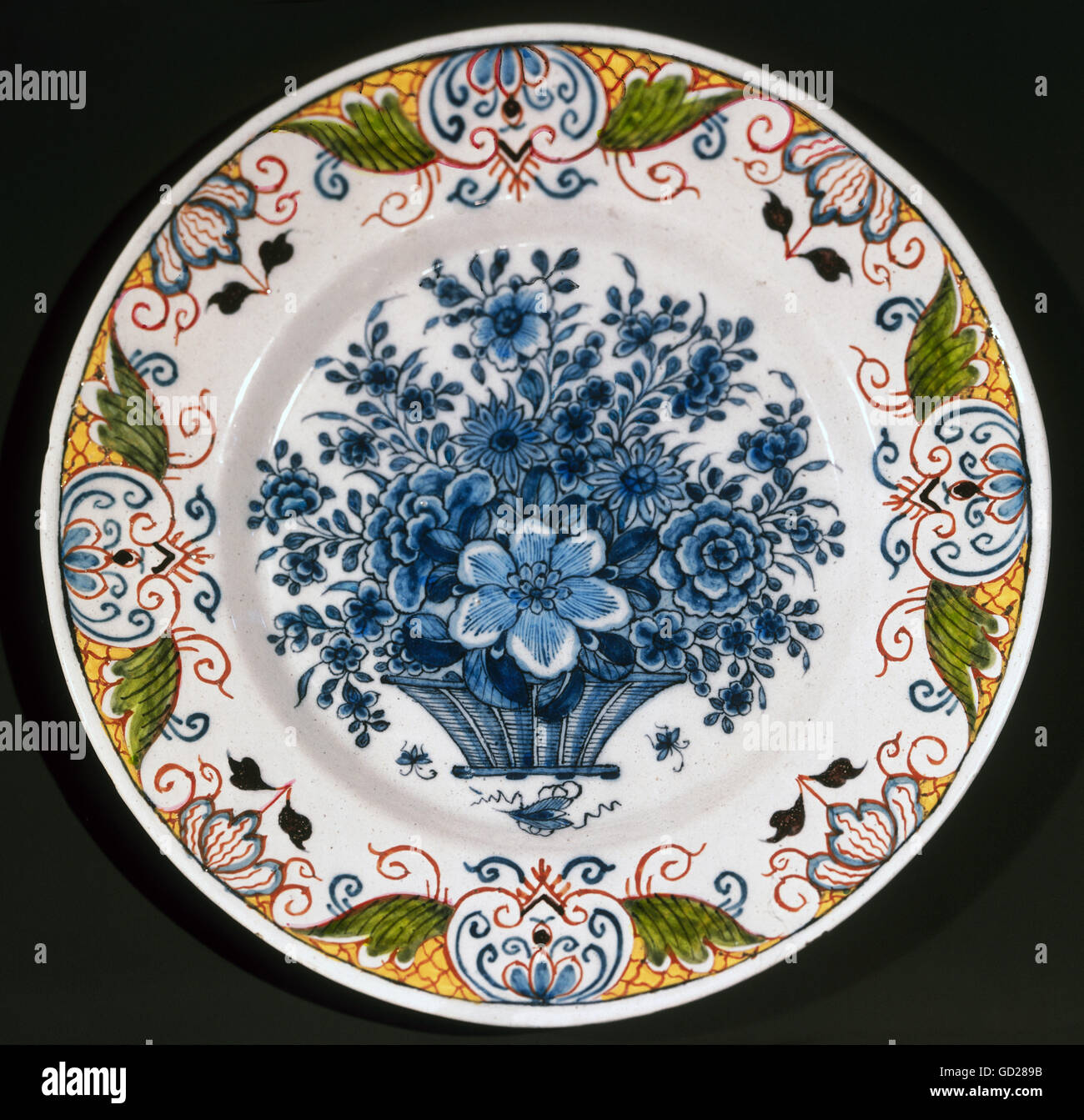 fine arts, faience, plate with flower basket in the centre and flower ornament on the edge, diameter 23 cm, Delft, 18th century, De Porceleyne Fles, Delft, Artist's Copyright has not to be cleared Stock Photo