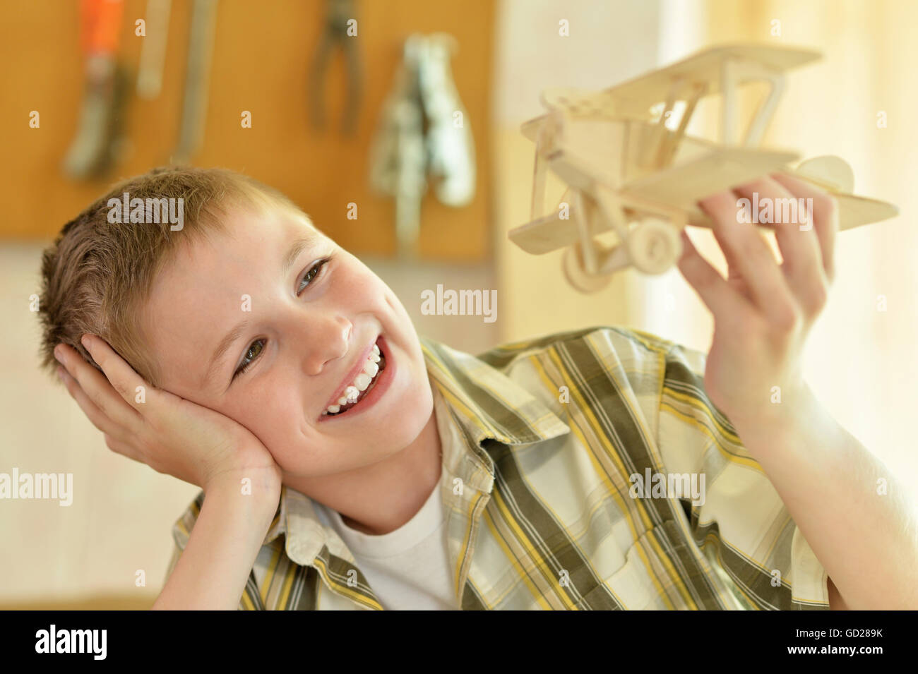 boy with a wooden airplane Stock Photo