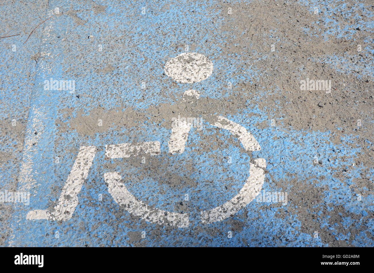 Old, weathered, wheel chair sign, handicapped sign, background, copy space, book cover, concrete Stock Photo