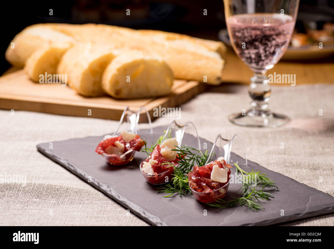 Appetizer with meat, Carpaccio and parmesan served on a Spoon Stock Photo