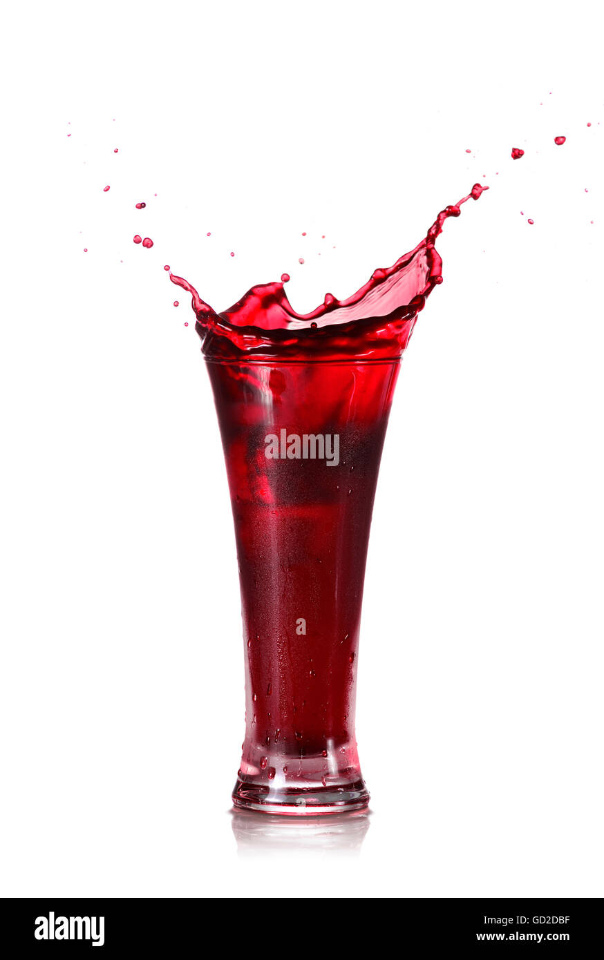 Red Juice Splash in A Glass Isolated on White Background Stock Photo
