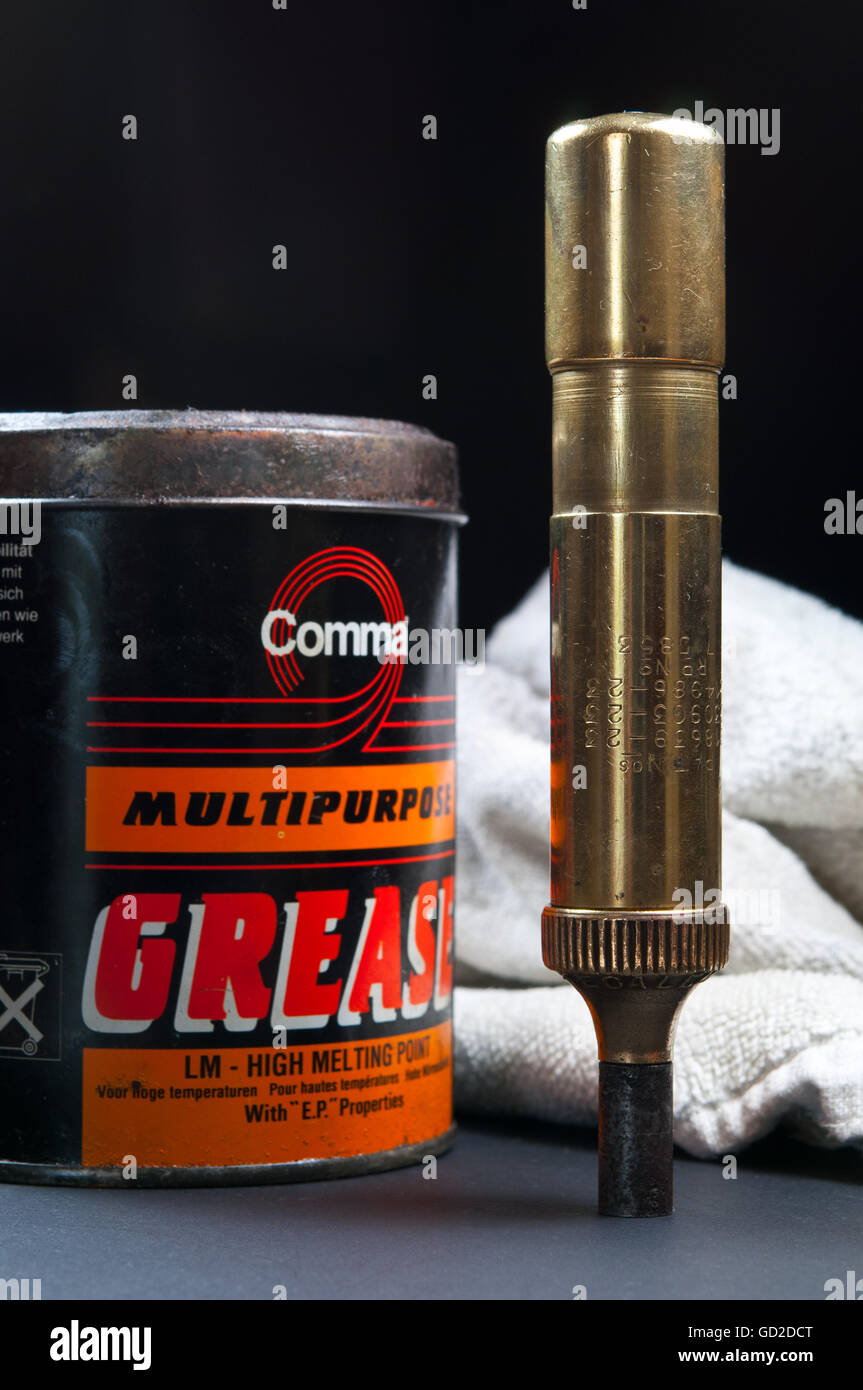 Tecalemit vintage brass grease gun and can of Comma grease, still life