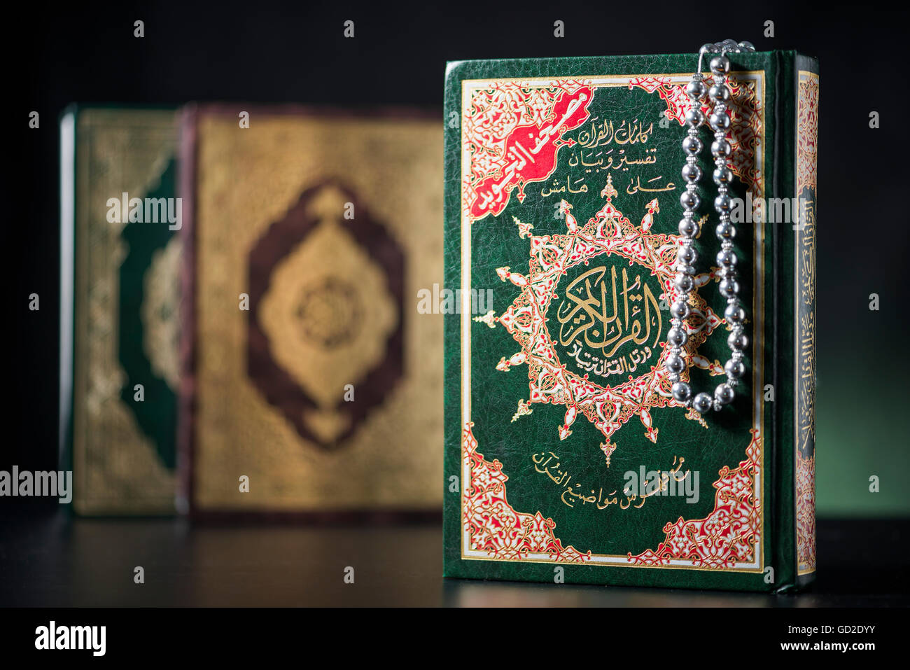 Islamic Books of Holy Quran on Soft Light Background Stock Photo