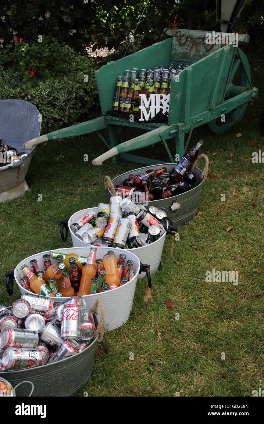 2ND JULY 2016,PORTSMOUTH,ENGLAND A vintage wheelbarrow and old tin