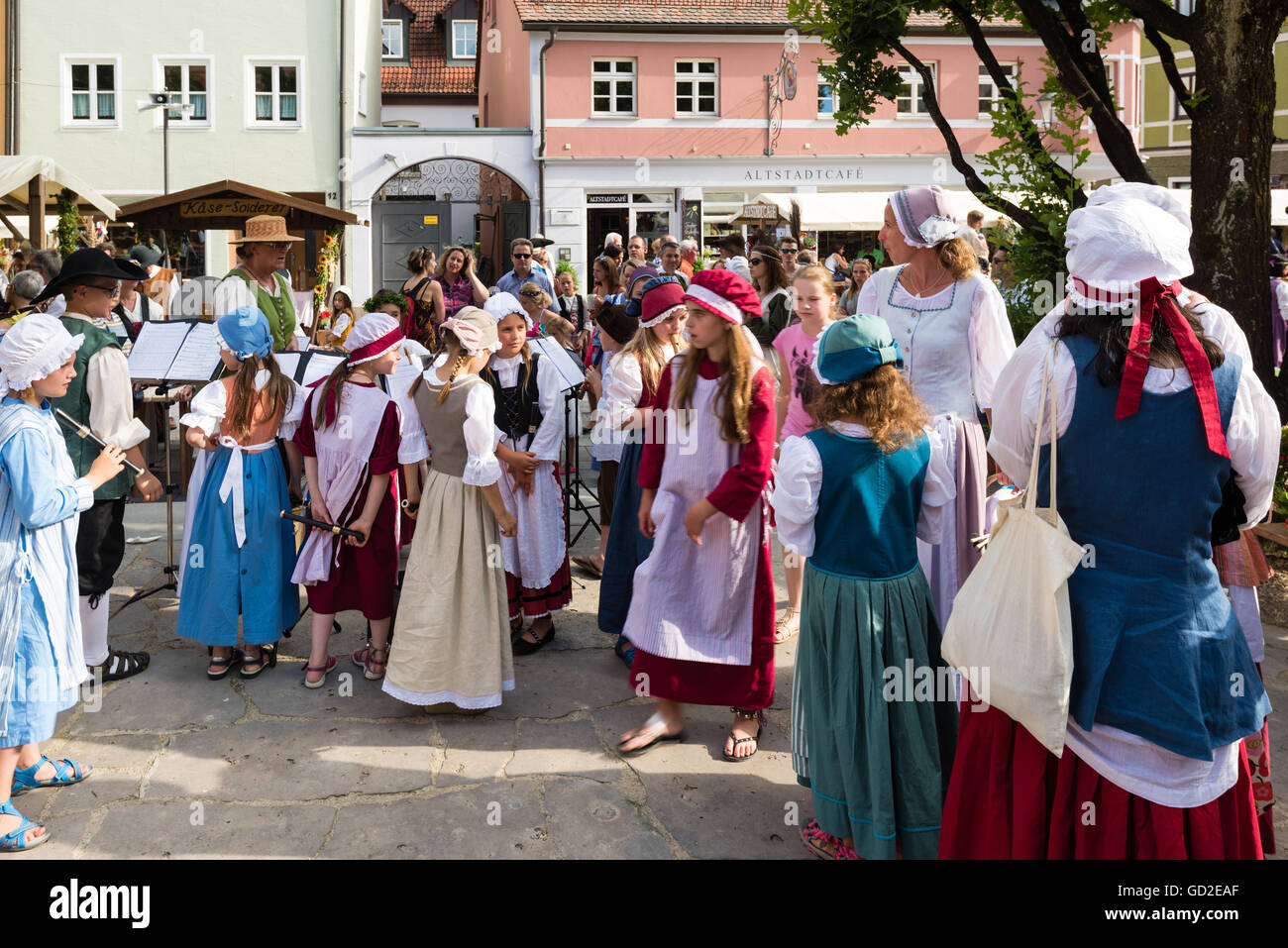 Friedberg, Germany - July 09, 2016: People mainly dressed in traditional costumes of the eighteenth century are watching childre Stock Photo