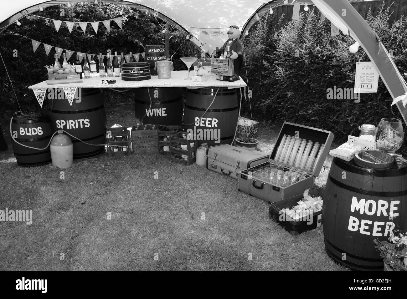 A vintage style beer tent for the celebration of a wedding in a garden with retro suitcases and beer barrels in portsmouth,england, 2nd july 2016 Stock Photo