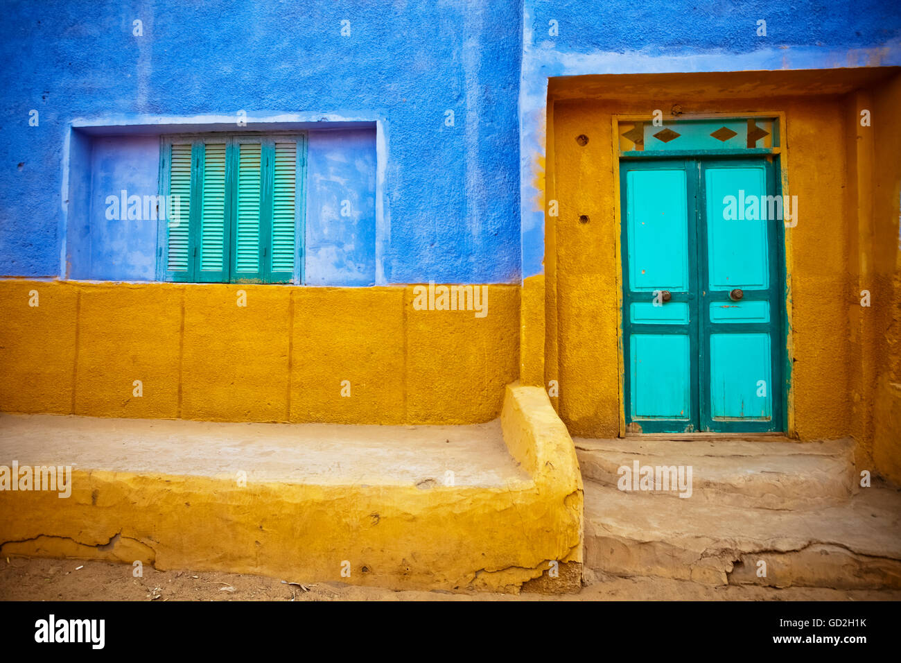 A colourful wall to a Nubian home in a village on the Nile; Egypt Stock Photo