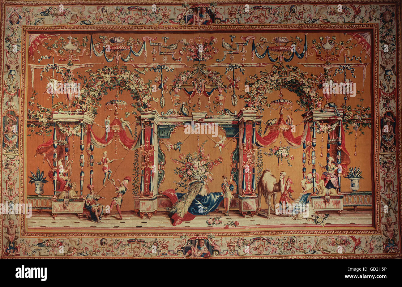 fine arts, tapestry, musicians and artists in phantastic architecture, from the grotesques series, by Philippe Behagle, after design by Jean Berain, Beauvais manufactory, circa 1700, silk, wool, knitted, 320 x 498 cm, Baden State Museum, Bruchsal castle, Artist's Copyright has not to be cleared Stock Photo