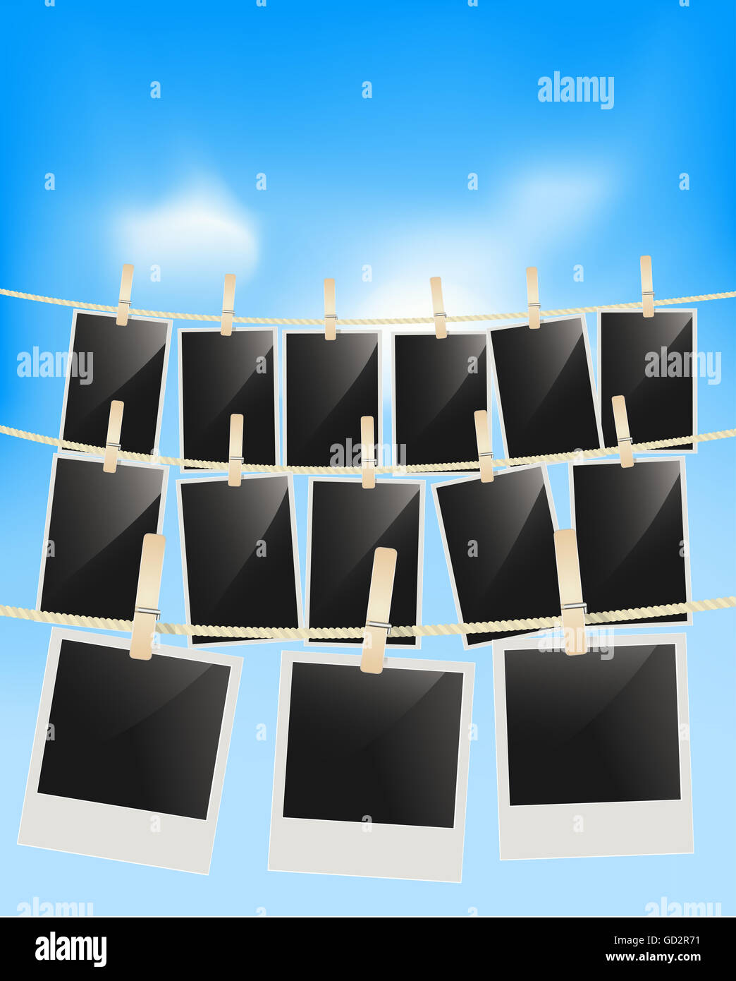 Photo frames hanging on clothesline Stock Photo