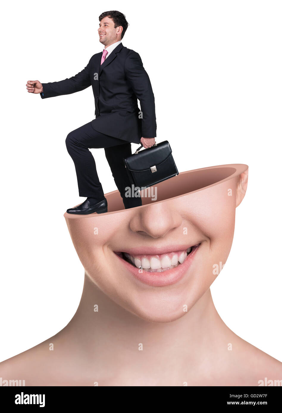 Businaessman with briefcase in open woman's head Stock Photo