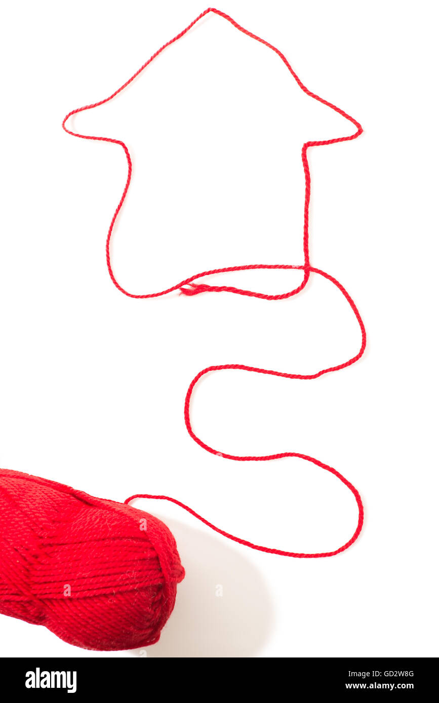 creative image of a house with red woolen threads on a white background ...