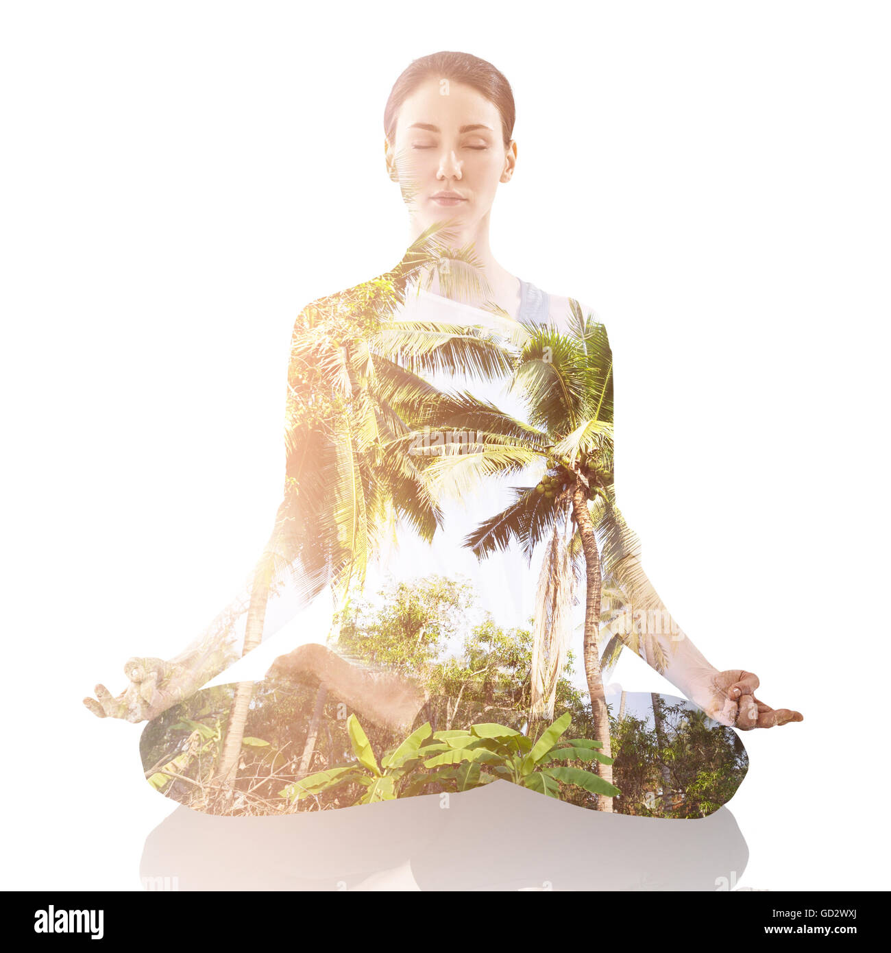 Woman practicing yoga in the lotus position Stock Photo