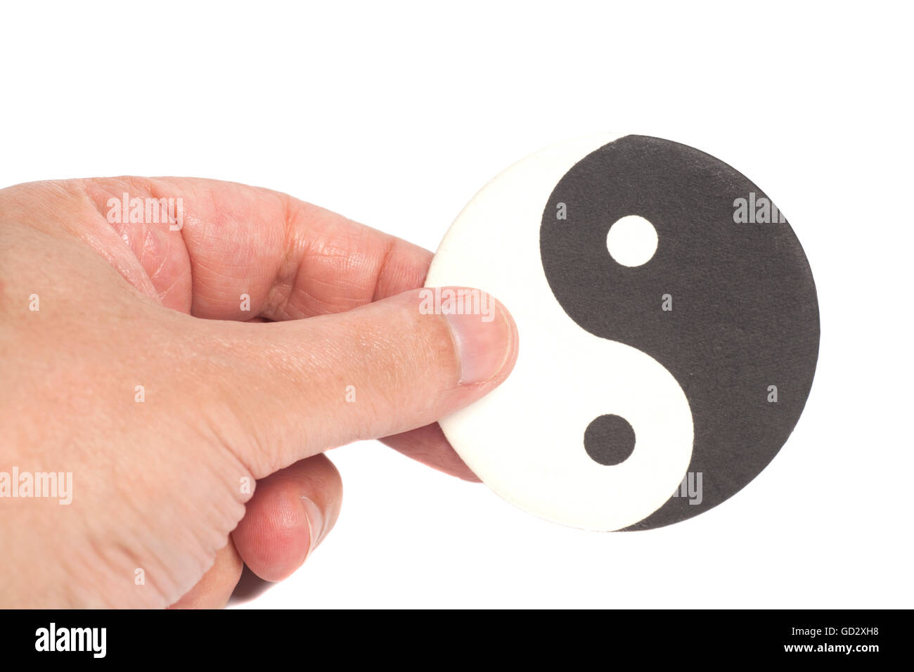 Hand Holding Yin-Yang Symbol isolated on white Stock Photo