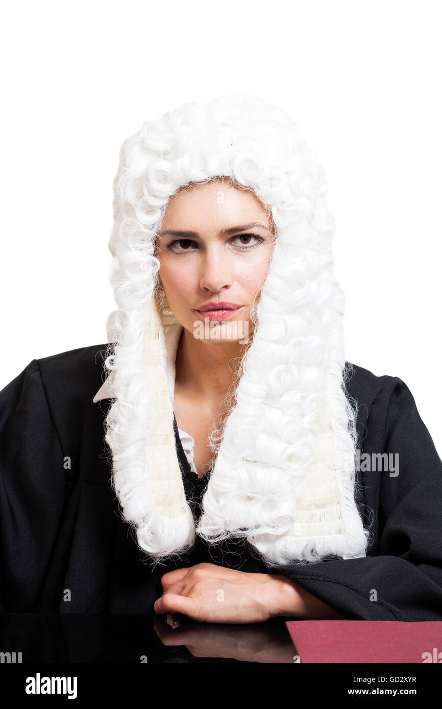 Female judge wearing a wig and black mantle isolated on white backgriund Stock Photo