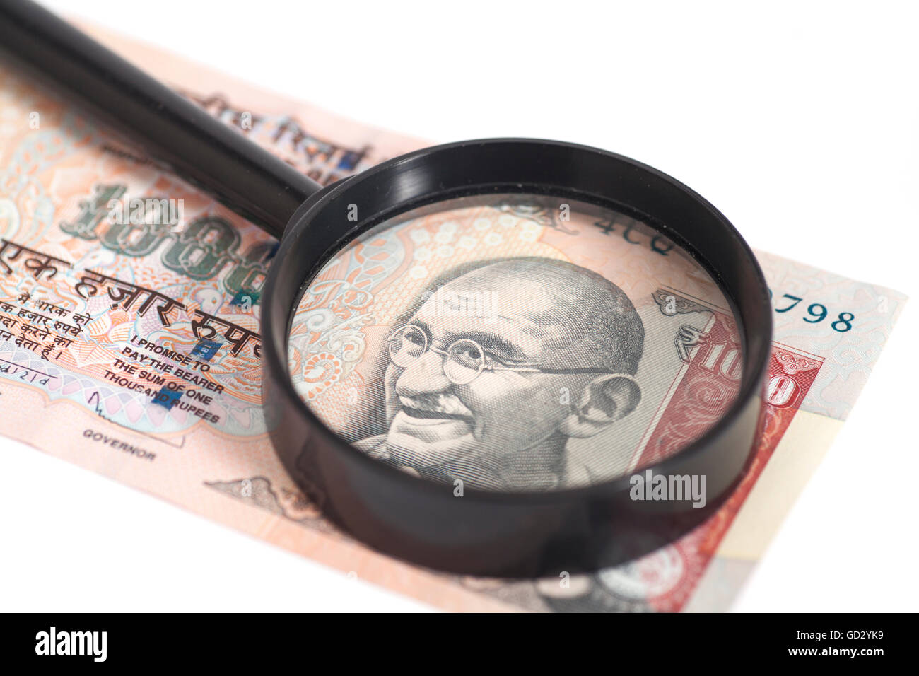 Indian Currency Rupee Note with magnifying glass isolated on white ...