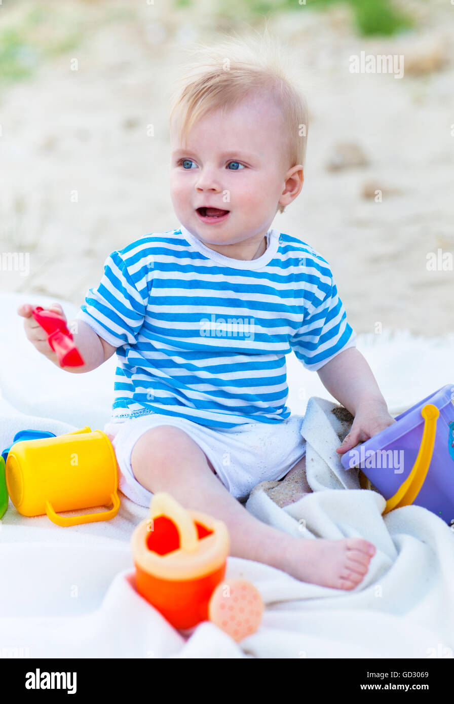 Cute baby girl playing with beach toys on the beach Stock Photo Alamy