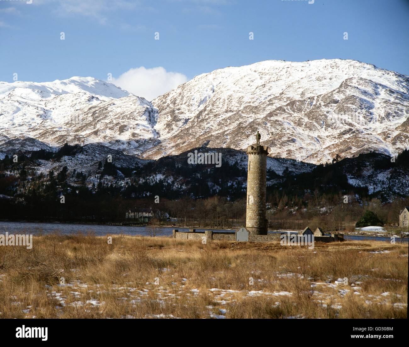 Scotland, Inverness-shire. Mid-winter in Glenfinnan, with the hills in snow. The monument to the rising of the standard in 1745 Stock Photo