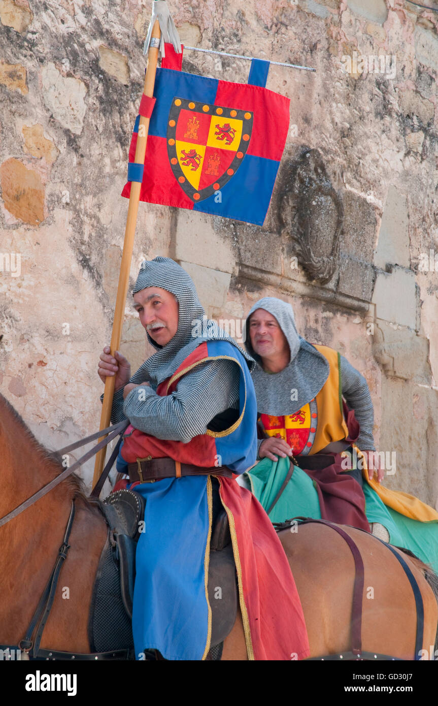 Two men wearing medieval clothes and riding horses. Medieval Days, Sigüenza, Guadalajara province, Castilla La Mancha, Spain. Stock Photo