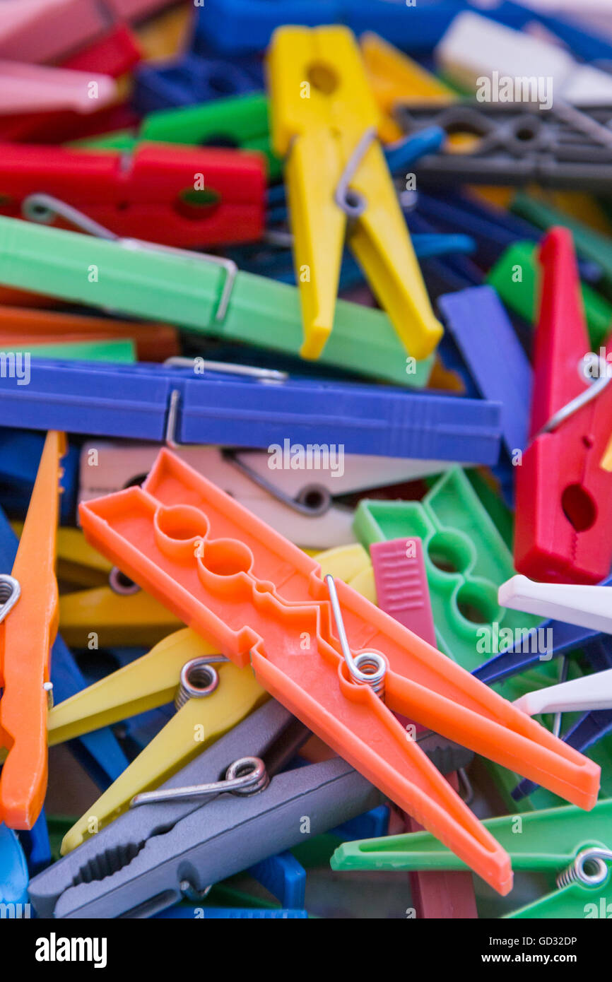 heap of plastic laundry clothespin in different vivid colors Stock