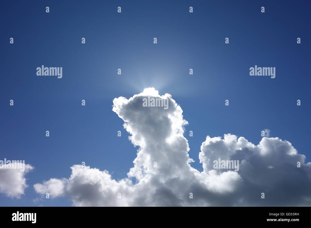 Sun breaking through thick cloud after rains finally pass Stock Photo