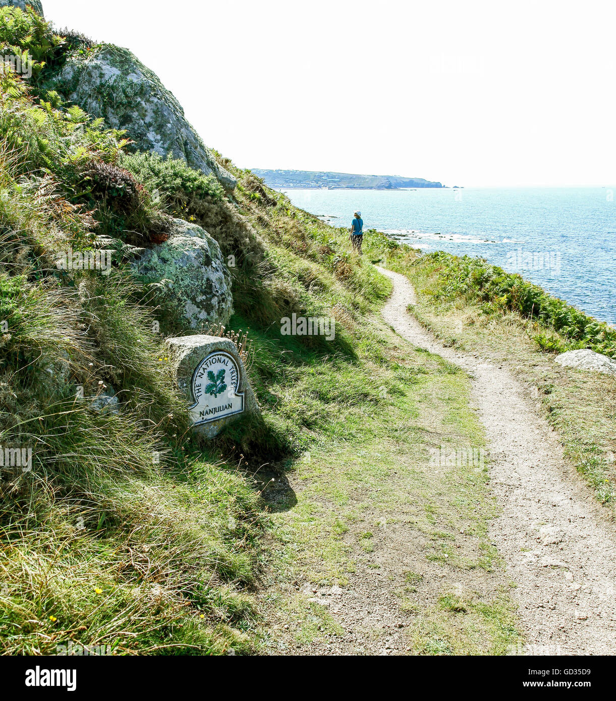 A National Trust omega sign at Nanjulian Cliffs Cornwall England UK * TAKEN FROM PUBLIC FOOTPATH * Stock Photo