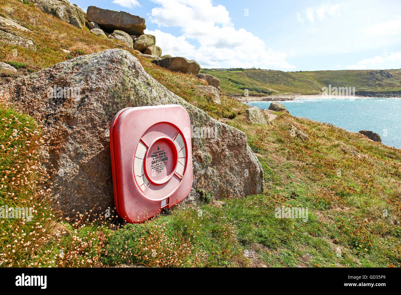 A life buoy on rocks at Aire Point near to Sennen Cove Cornwall England UK Stock Photo