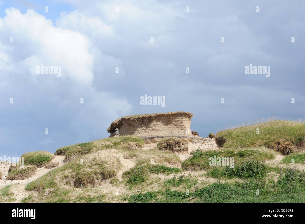 Turf growing on a sandy base collapses  as the sand is eroded by wind.   Islay, Inner Hebrides, Argyll, Scotland, UK. Stock Photo