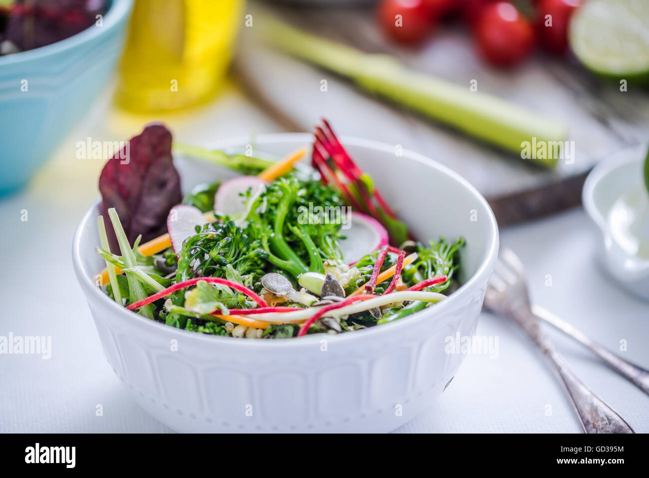 vibrant crunchy salad in bowl on bright cloth Stock Photo