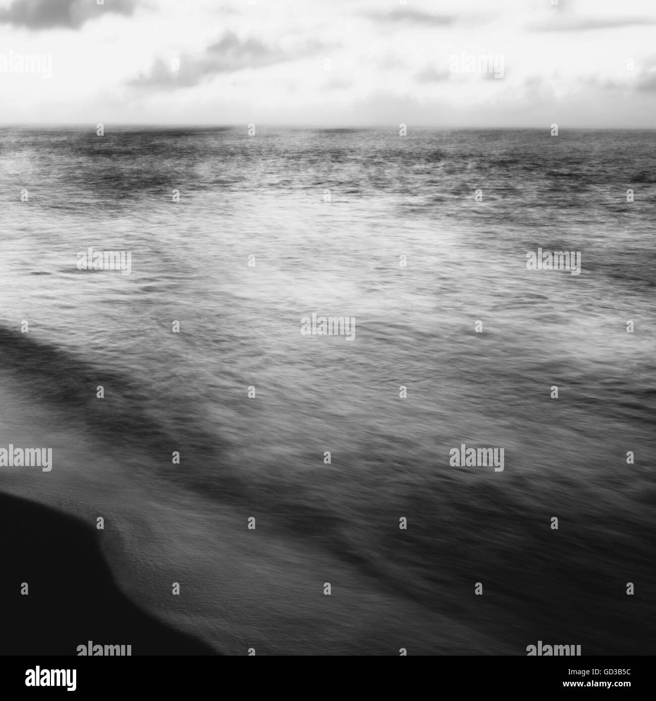 Blurred motion, the surface of the sea at dawn. Stock Photo