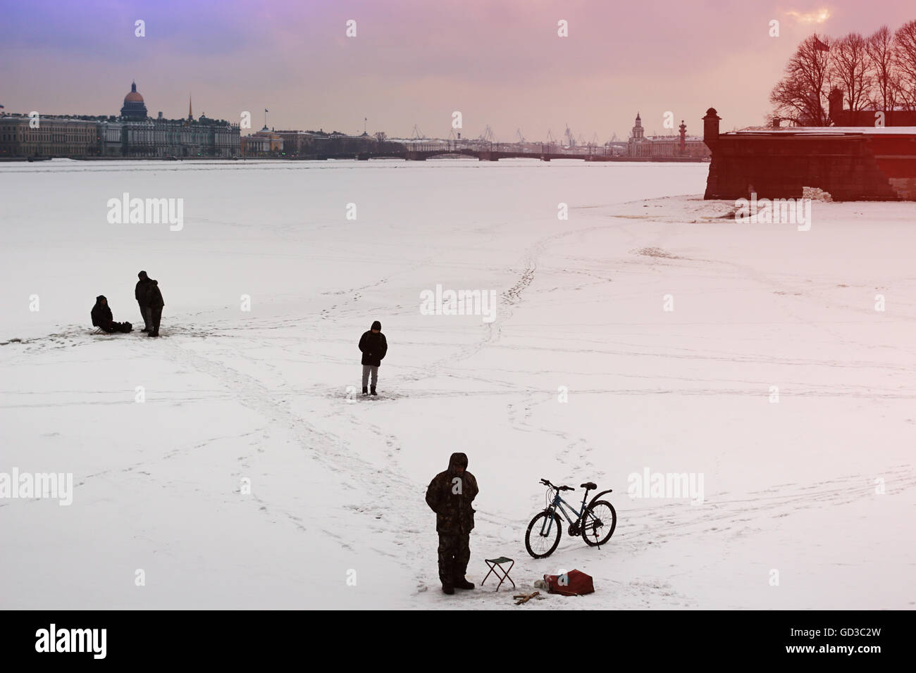 Fishermen on the winter river ( Neva, St.Petersburg, Russia) Stock Photo