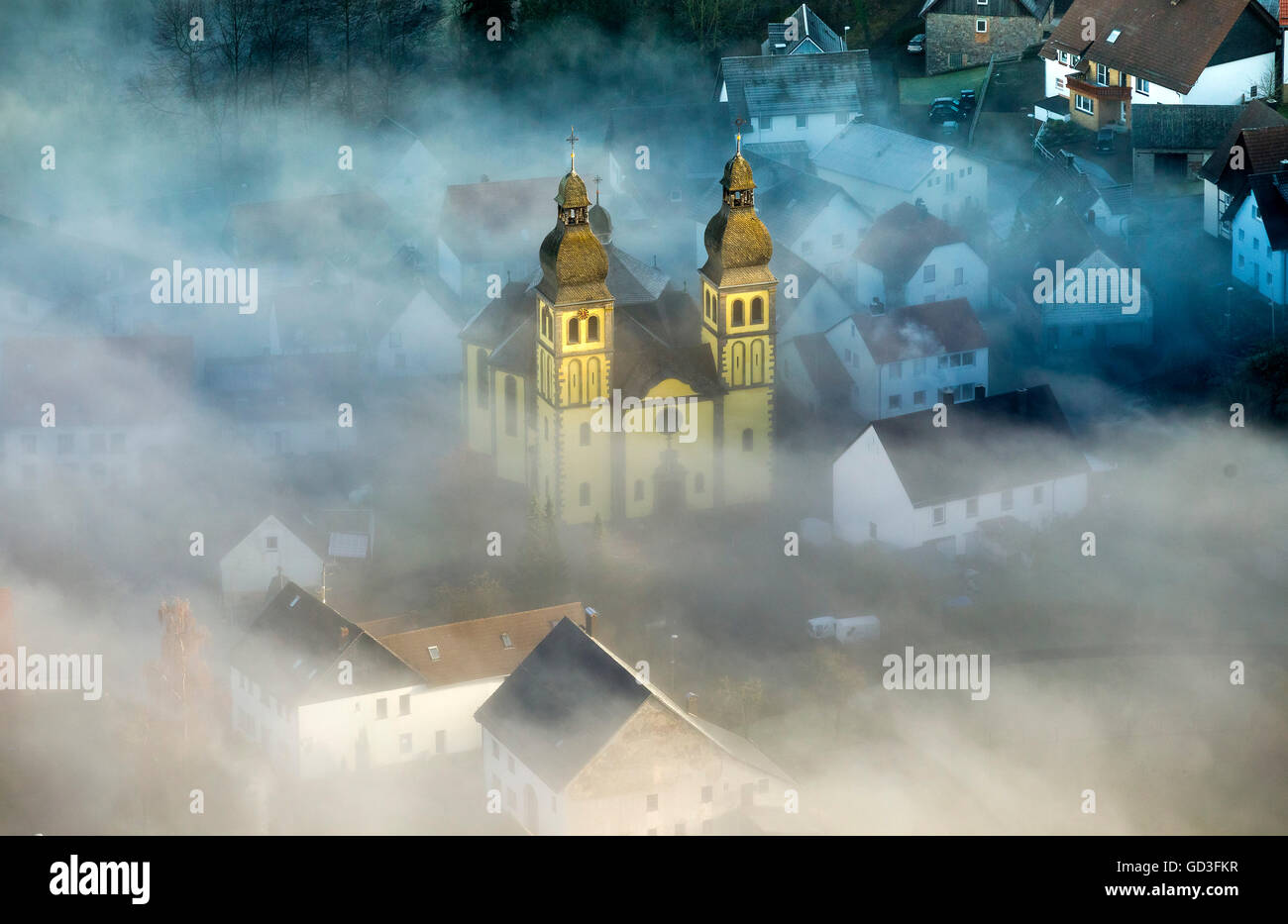 Aerial view, Parish Church of St Mary Magdalene with ground fog, smoke screen, Padberg, Sauerland, North Rhine Westphalia, Stock Photo