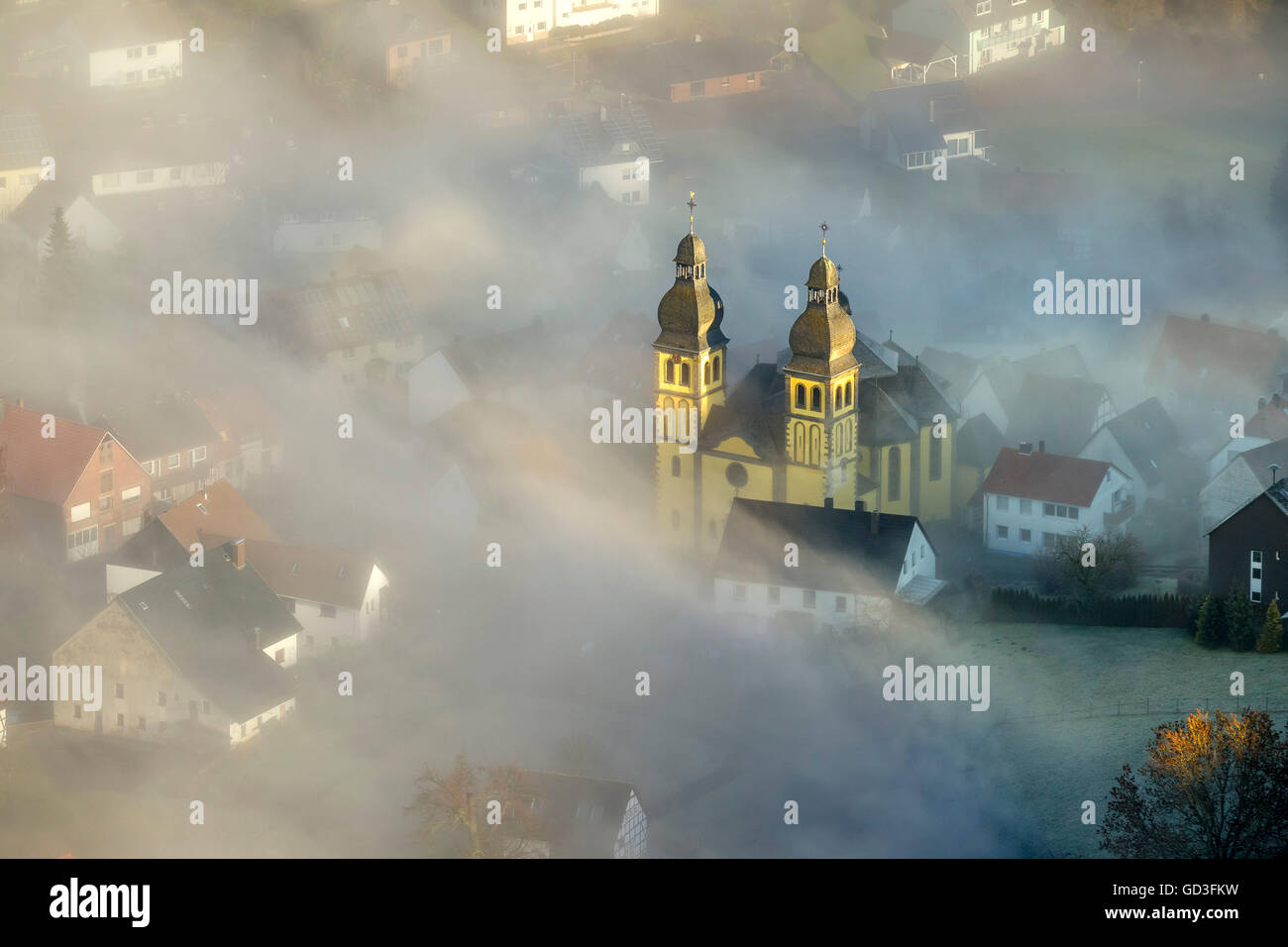 Aerial view, Parish Church of St Mary Magdalene with ground fog, smoke screen, Padberg, Sauerland, North Rhine Westphalia, Stock Photo