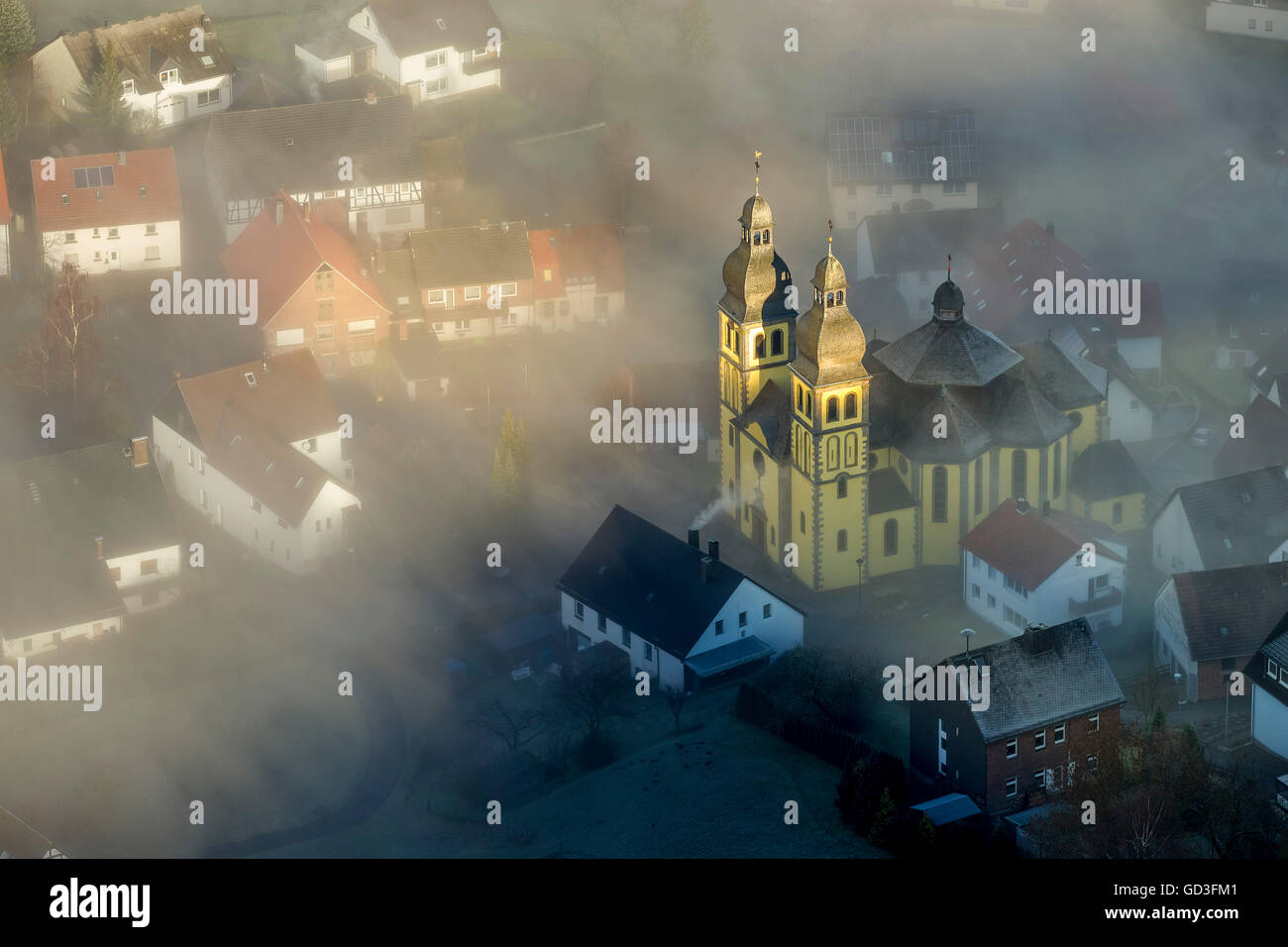Aerial view, Parish Church of St Mary Magdalene with ground fog, smoke screen, Padberg, Sauerland, North Rhine Westphalia, Stock Photo