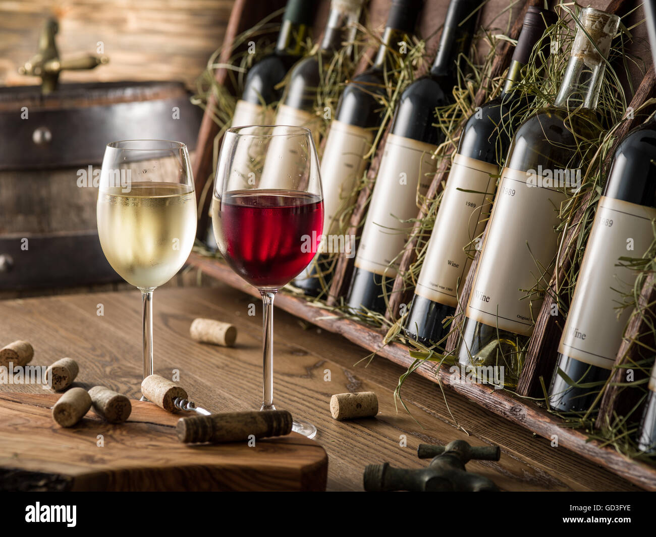 Wine bottles on the wooden shelf. Stock Photo