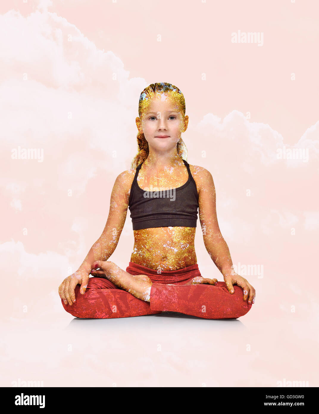 Little girl in red clothing sitting lotus position. Double exposure effect Stock Photo