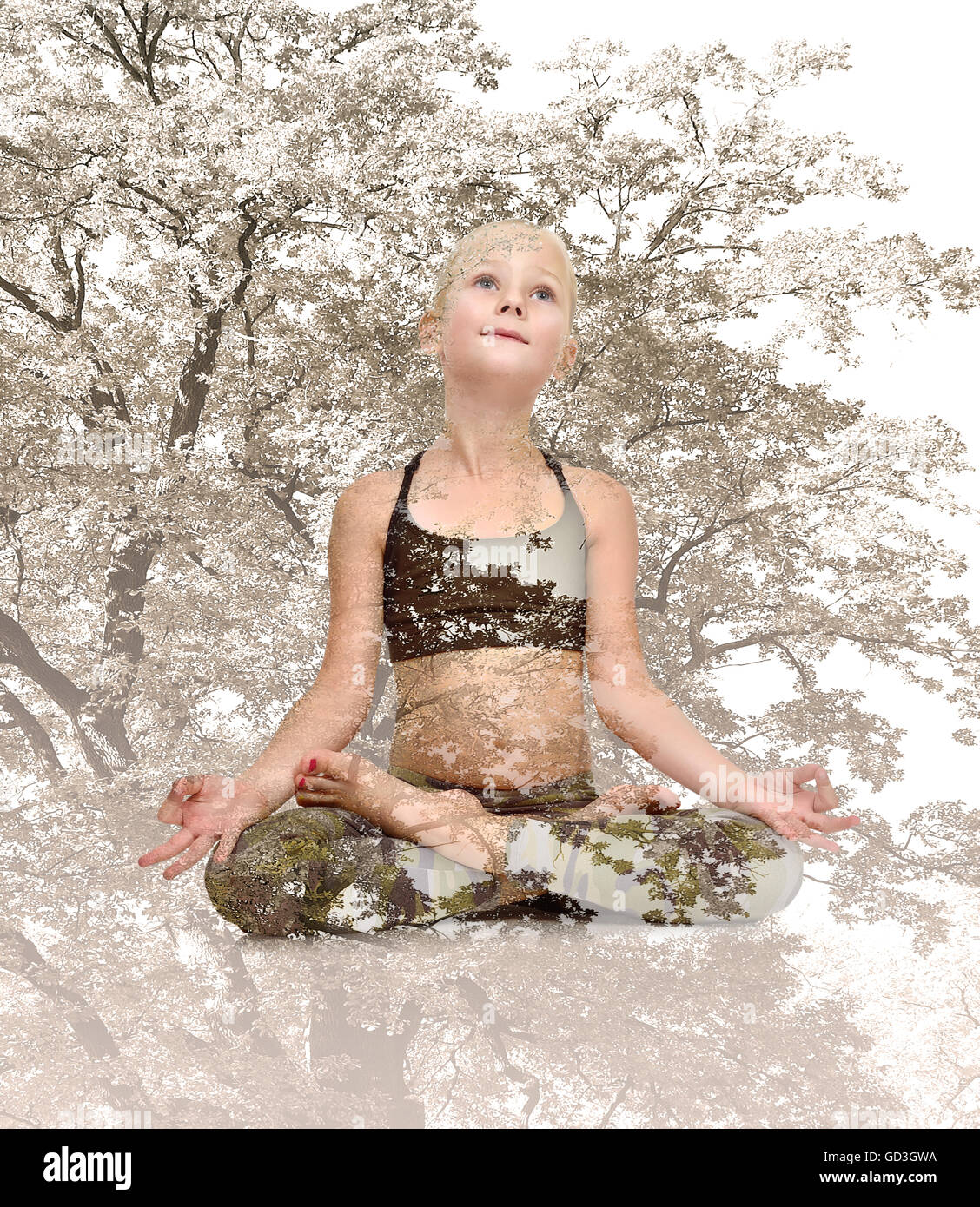 Little yoga girl sitting lotus position, Double exposure effect Stock Photo