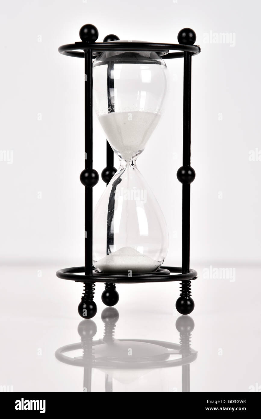 Black sand clock on a white background Stock Photo