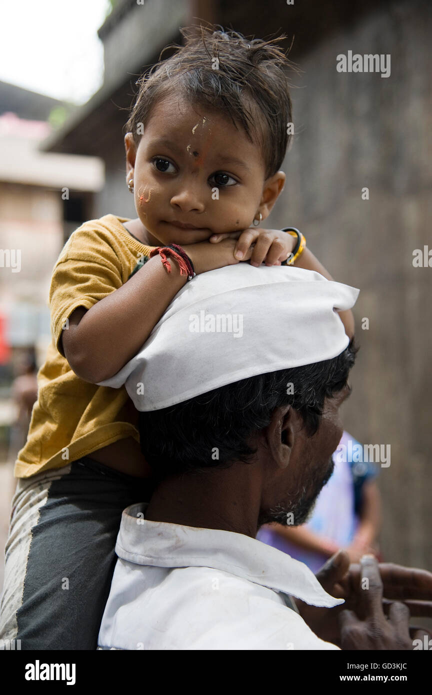 Small girl sitting on man shoulder, Nasik, maharashtra, india, asia Stock Photo