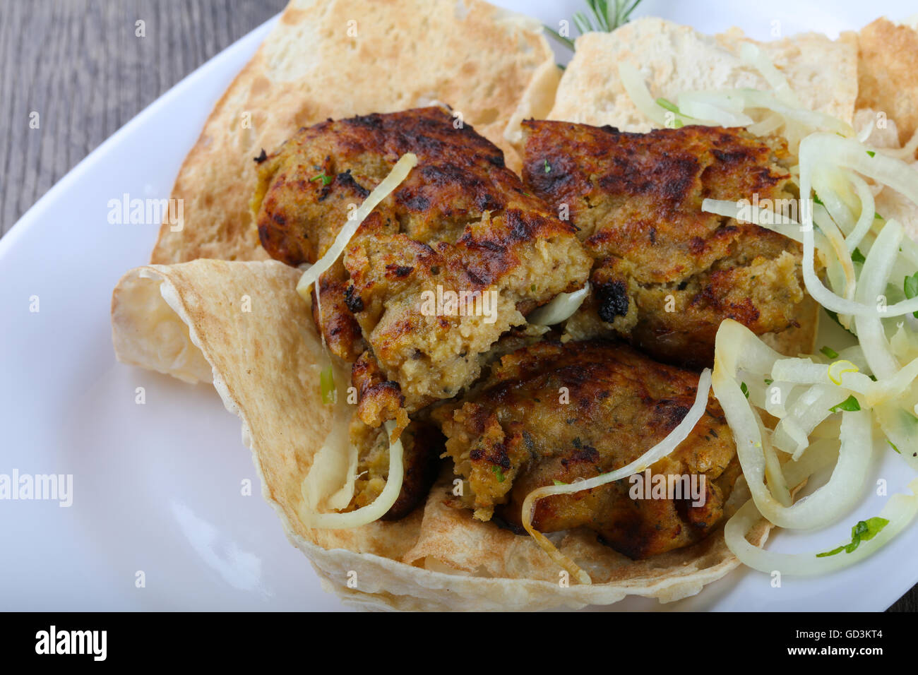 Vegetarian potato kebab with onion, parsley and bread Stock Photo Alamy