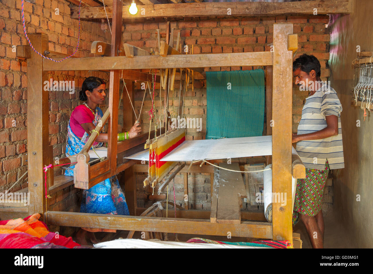 Woman weaving clothes on handloom, bastar, chhattisgarh, india, asia Stock Photo