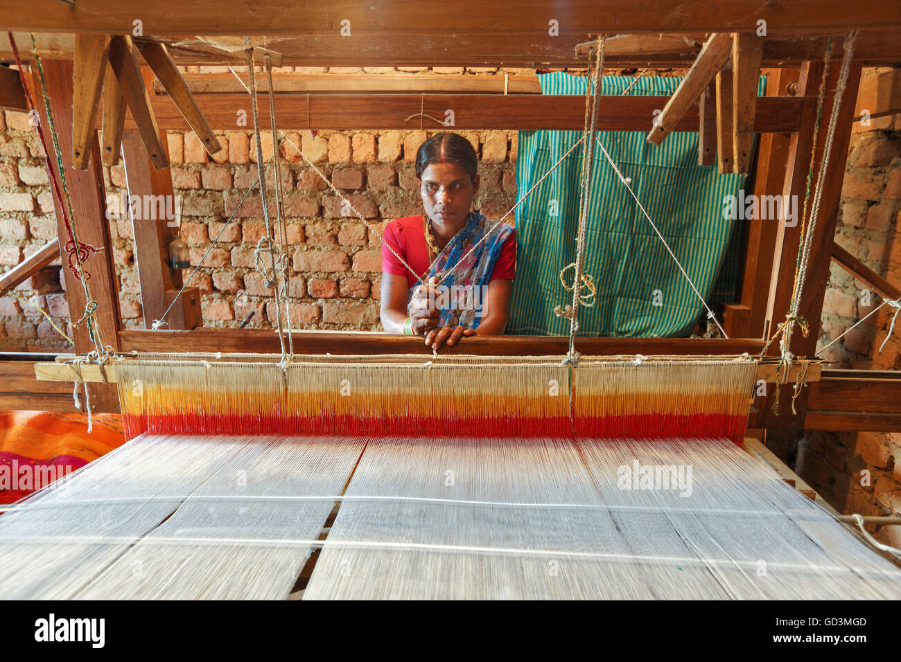 Woman weaving clothes on handloom, bastar, chhattisgarh, india, asia