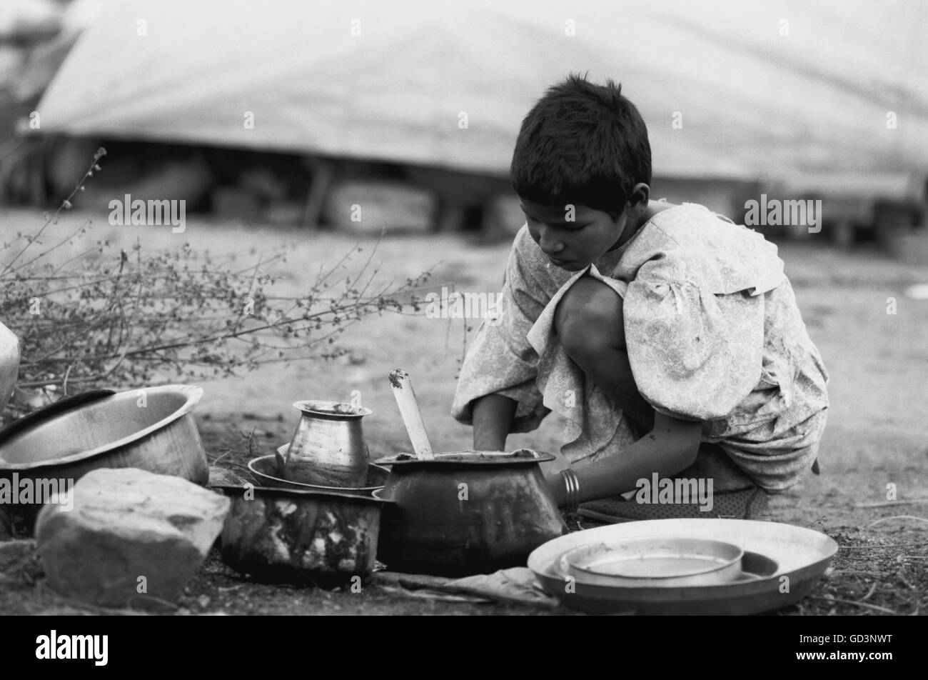 Poor boy Black and White Stock Photos & Images - Alamy