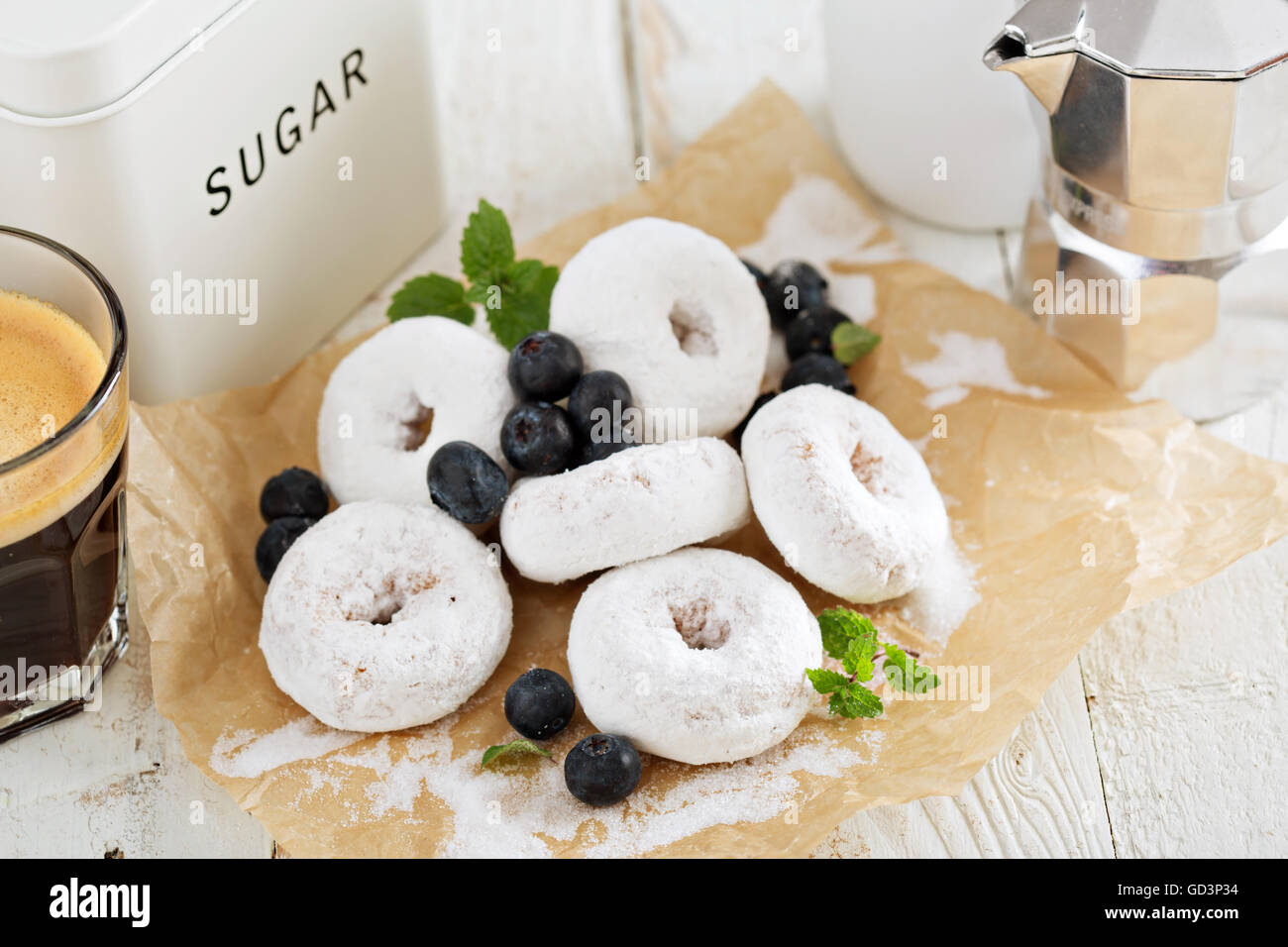 Small donuts in powdered sugar Stock Photo